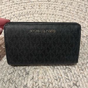 Michael Kors Monogram Wallet in Black with snap closure